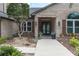Charming brick home featuring an inviting entrance with double doors and manicured landscaping at 6936 River Rd, New Port Richey, FL 34652