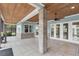 Beautiful screened porch with brick columns, ceiling fans, and tiled floor at 6936 River Rd, New Port Richey, FL 34652