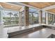 Spacious screened porch with granite countertop, power outlets, and lake views at 6936 River Rd, New Port Richey, FL 34652