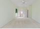 Spacious bedroom with doorway leading to bathroom at 7328 Blue Skies Dr, Spring Hill, FL 34606