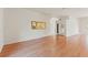 Spacious living room featuring hardwood floors and white walls at 7328 Blue Skies Dr, Spring Hill, FL 34606