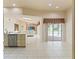 Open living room featuring a view of the pool, skylights, and tile flooring at 7328 Blue Skies Dr, Spring Hill, FL 34606
