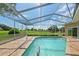 Refreshing pool and screened enclosure offer a serene escape with scenic golf course views at 7328 Blue Skies Dr, Spring Hill, FL 34606