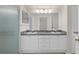Bathroom featuring double sink vanity and a glass shower at 7445 Nature Walk Dr, Spring Hill, FL 34606