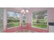 Cozy breakfast nook with large windows, allowing for abundant natural light and views of the outdoors at 7445 Nature Walk Dr, Spring Hill, FL 34606