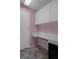 This home office offers storage cabinets and a built-in desk at 7445 Nature Walk Dr, Spring Hill, FL 34606