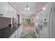 Open kitchen showcases stainless appliances and a sunlit breakfast nook at 7445 Nature Walk Dr, Spring Hill, FL 34606