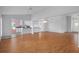 Open living room, with hardwood floors and kitchen view, perfect for entertaining guests at 7445 Nature Walk Dr, Spring Hill, FL 34606