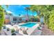 Inviting backyard pool area with a patio, lounge chairs, and lush landscaping for ultimate relaxation at 750 Lantana Ave, Clearwater, FL 33767