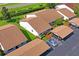 An aerial view of townhomes with well-kept landscaping and assigned parking at 7715 Radcliffe Cir, Port Richey, FL 34668
