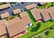 An aerial shot showcases private patios and well-kept grounds in a residential neighborhood at 7715 Radcliffe Cir, Port Richey, FL 34668