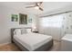 Bedroom featuring decorative curtains and a comfortable bed at 7715 Radcliffe Cir, Port Richey, FL 34668