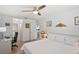 Bedroom with wood floors, artwork, and a quaint desk with a comfortable chair at 7715 Radcliffe Cir, Port Richey, FL 34668