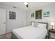 Bedroom with light gray walls, ceiling fan, light wood floor, and simple decor at 7715 Radcliffe Cir, Port Richey, FL 34668