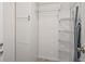 Storage closet features adjustable wire shelving, cabinetry, and ample storage space at 7715 Radcliffe Cir, Port Richey, FL 34668