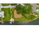Aerial view highlighting the property lines of a waterfront home with a private dock and outdoor seating area at 8143 Channel Dr, Port Richey, FL 34668