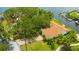 Aerial view features a charming waterfront home with lush landscaping and private access to the bay at 8143 Channel Dr, Port Richey, FL 34668