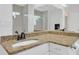 Bathroom vanity with granite countertop and large mirror at 8143 Channel Dr, Port Richey, FL 34668