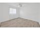 Bright bedroom featuring wood-look flooring, ceiling fan, and ample natural light at 8143 Channel Dr, Port Richey, FL 34668