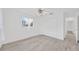 Sun-filled bedroom with closet and light-toned wood-look floors at 8143 Channel Dr, Port Richey, FL 34668