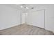 Bedroom featuring bright flooring, large closet, and backyard view at 8143 Channel Dr, Port Richey, FL 34668