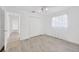 Light-filled bedroom with modern flooring, closet, and neutral decor at 8143 Channel Dr, Port Richey, FL 34668