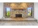 Stone fireplace with hearth and built-in mantle, and water views from windows at 8143 Channel Dr, Port Richey, FL 34668