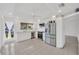 Bright kitchen with stainless steel appliances, white cabinetry, and view to the outside at 8143 Channel Dr, Port Richey, FL 34668
