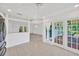 Bright living area with view to the kitchen and outdoor patio at 8143 Channel Dr, Port Richey, FL 34668