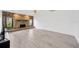 Bright living room with stone fireplace and wood-look floors at 8143 Channel Dr, Port Richey, FL 34668