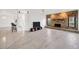 Spacious living room featuring a stone fireplace and water views at 8143 Channel Dr, Port Richey, FL 34668