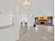 Spacious living room features tile floors, a stone fireplace, white walls, and a bar area at 8143 Channel Dr, Port Richey, FL 34668