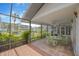 Enclosed patio featuring stone floors and views of tropical waterway at 8143 Channel Dr, Port Richey, FL 34668