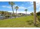 Scenic waterfront view featuring boat docks, lush landscaping, and multi-story residential buildings at 8143 Channel Dr, Port Richey, FL 34668