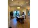 Spacious dining room featuring elegant decor and natural light from large windows at 8209 Golf Club Ct, Hudson, FL 34667