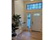 Inviting foyer with modern accents, stylish table, and decorative lighting at 8209 Golf Club Ct, Hudson, FL 34667