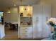 Extended kitchen cabinets with granite counters provides ample storage and prep space at 8209 Golf Club Ct, Hudson, FL 34667