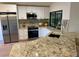 Modern kitchen with stainless steel appliances and granite countertops at 8209 Golf Club Ct, Hudson, FL 34667
