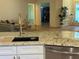 Granite countertops and stainless steel appliances create an elegant and functional kitchen space at 8209 Golf Club Ct, Hudson, FL 34667