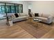 Comfortable living room with stylish furnishings and plenty of natural light at 8209 Golf Club Ct, Hudson, FL 34667
