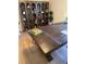 Close-up shot of home office featuring wood desk, bookshelf and wood flooring at 8209 Golf Club Ct, Hudson, FL 34667
