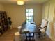 Bright office featuring dark wood desk, paneled walls, and natural light at 8209 Golf Club Ct, Hudson, FL 34667