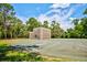 A basketball court surrounded by lush greenery, offering a great space for recreational activities and exercise at 8540 Caitlin Ct, Hudson, FL 34667