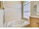 Bathroom showcasing a jetted tub with decorative tile, designed for a relaxing spa-like experience at 8540 Caitlin Ct, Hudson, FL 34667