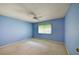 Cozy bedroom with a ceiling fan and window, creating a comfortable retreat at 8540 Caitlin Ct, Hudson, FL 34667