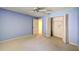 Serene bedroom with a light blue wall color and closet space, creating a peaceful ambiance at 8540 Caitlin Ct, Hudson, FL 34667