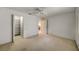 A bright bedroom with a ceiling fan and a closet at 8540 Caitlin Ct, Hudson, FL 34667