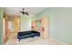 Spacious bedroom with built-ins, ceiling fan, and connected bathroom at 8540 Caitlin Ct, Hudson, FL 34667