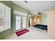 Bedroom with ceiling fan, a sliding glass door and built-in shelving at 8540 Caitlin Ct, Hudson, FL 34667