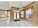 Cozy nook with a window view to the pool, adjacent to the kitchen, with tile flooring at 8540 Caitlin Ct, Hudson, FL 34667